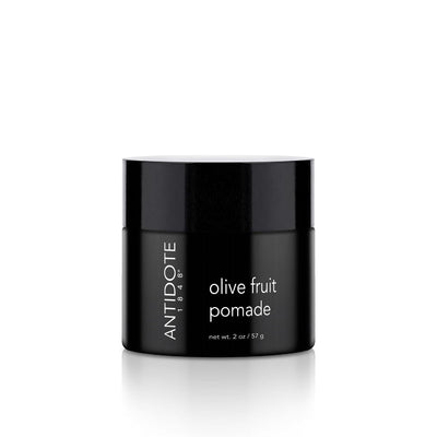 Close-up of olive fruit pomade texture with shea butter and coconut oil